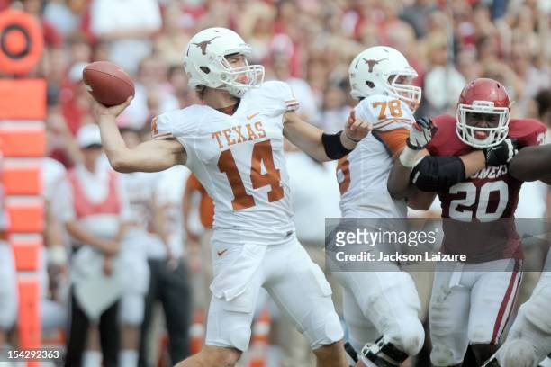 Quarterback David Ash of the Texas Longhorns throws a pass during their game against the Oklahoma Sooners on October 13, 2012 at The Cotton Bowl in...