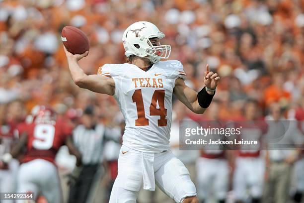Quarterback David Ash of the Texas Longhorns throws a pass during their game against the Oklahoma Sooners on October 13, 2012 at The Cotton Bowl in...