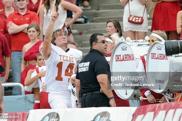 Quarterback David Ash of the Texas Longhorns leaves the field after an injury during their game against the Oklahoma Sooners on October 13, 2012 at...