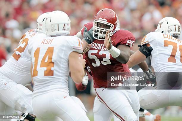 Defensive tackle Casey Walker of the Oklahoma Sooners pressures quarterback David Ash of the Texas Longhorns on October 13, 2012 at The Cotton Bowl...