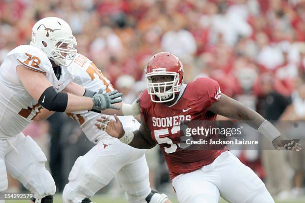 Defensive tackle Casey Walker of the Oklahoma Sooners pressures quarterback David Ash of the Texas Longhorns on October 13, 2012 at The Cotton Bowl...