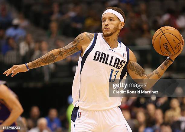 Delonte West of the Dallas Mavericks passes the ball against the Phoenix Suns during a preseason game at American Airlines Center on October 17, 2012...