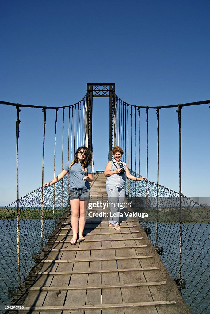 Young woman on bridge