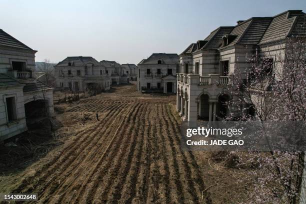 This aerial photo taken on March 31, 2023 shows deserted villas in a suburb of Shenyang in China's northeastern Liaoning province. China's real...