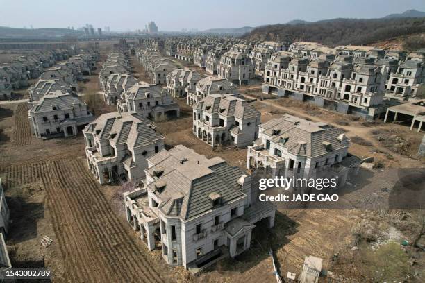 This aerial photo taken on March 31, 2023 shows deserted villas in a suburb of Shenyang in China's northeastern Liaoning province. China's real...