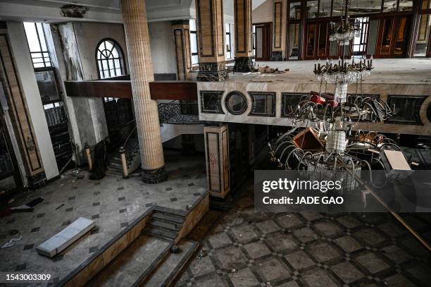 This photo taken on March 31, 2023 shows the interior of a deserted housing sales building in a suburb of Shenyang in China's northeastern Liaoning...