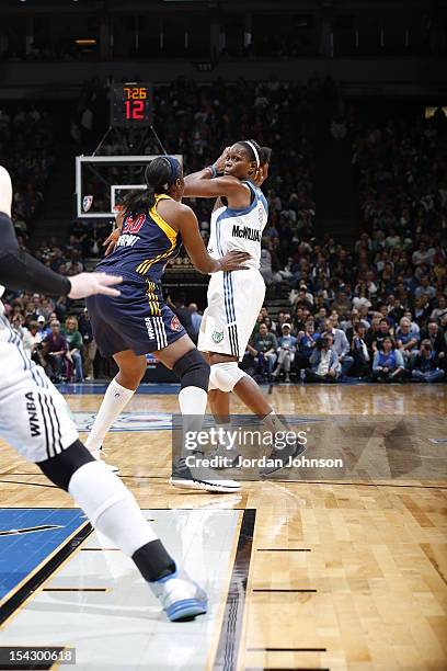 Taj McWilliams-Franklin of the Minnesota Lynx looks to pass the ball against Jessica Davenport of the Indiana Fever during the 2012 WNBA Finals Game...