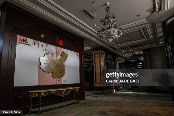 This photo taken on March 31, 2023 shows the interior of a deserted housing sales building in a suburb of Shenyang in China's northeastern Liaoning...