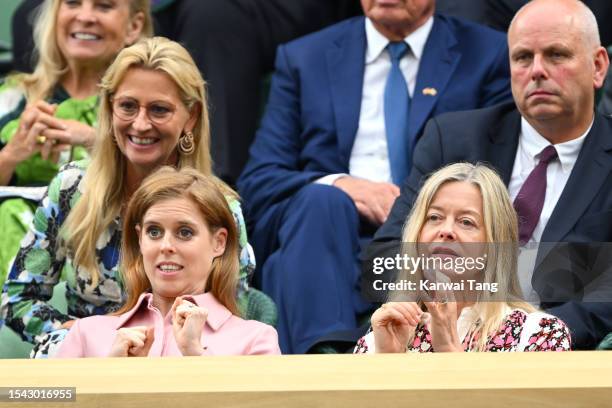 Princess Beatrice and Lady Helen Taylor react as they attend day twelve of the Wimbledon Tennis Championships at All England Lawn Tennis and Croquet...