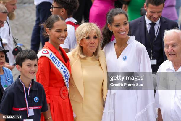 Miss France 2023 Indira Ampiot,Brigitte Macron and a Guest attend the annual Bastille Day military parade on July 14, 2023 in Paris, France. France...