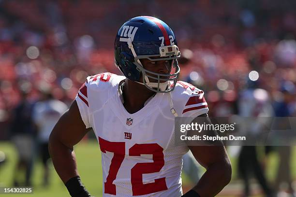 Defensive end Osi Umenyiora of the New York Giants warms up for the game with the San Francisco 49ers at Candlestick Park on October 14, 2012 in San...