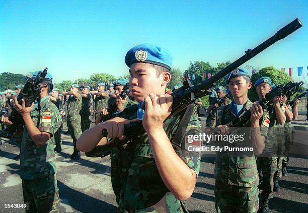 Peacekeeping soldiers from Singapore line up during a farewell ceremony May 17, 2002 in Dili, East Timor. The country will formally declare...