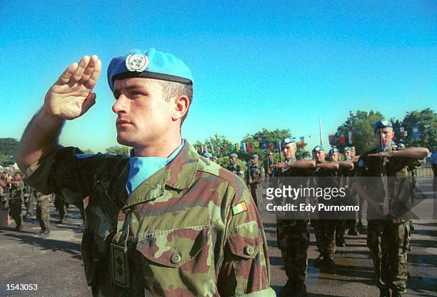Peacekeeping soldiers from Portugal salute during a farewell ceremony May 17, 2002 in Dili, East Timor. The country will formally declare...