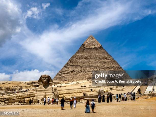 Visiting Pyramids Groups Of Tourists Visiting The Great Sphinx And Pyramid Of Khafre Giza ...