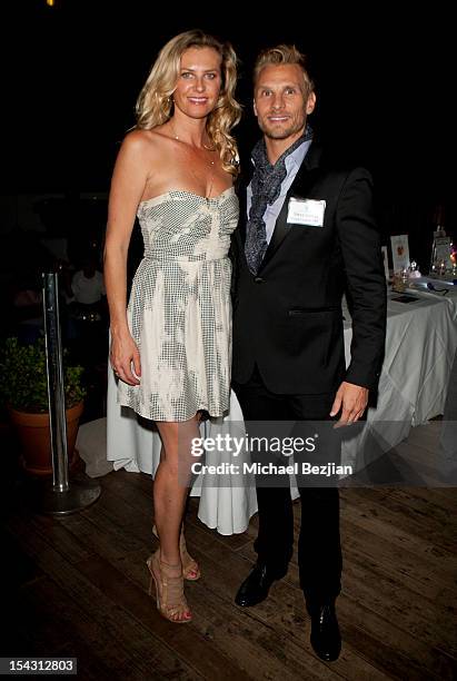 Model Gina Clarke and host Steve Jordan attend Exceptional Children's Foundation Fundraising Gala at SkyBar at the Mondrian Los Angeles on October...