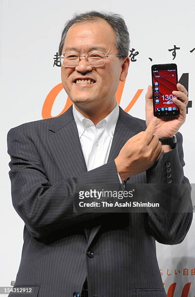 Corp., president Takashi Tanaka introduces its 'au' brand new mobile phones at a press conference on October 17, 2012 in Tokyo, Japan.