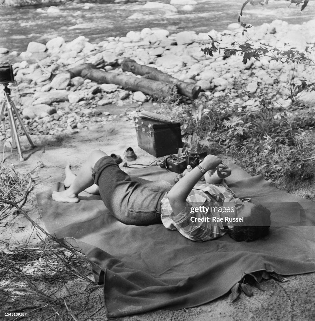 Russel Rae American photographer Rae Russel inspects photographic equipment as ...