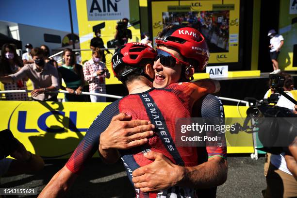 Tom Pidcock of United Kingdom and stage winner Michal Kwiatkowski of Poland and Team INEOS Grenadiers react after the stage thirteen of the 110th...