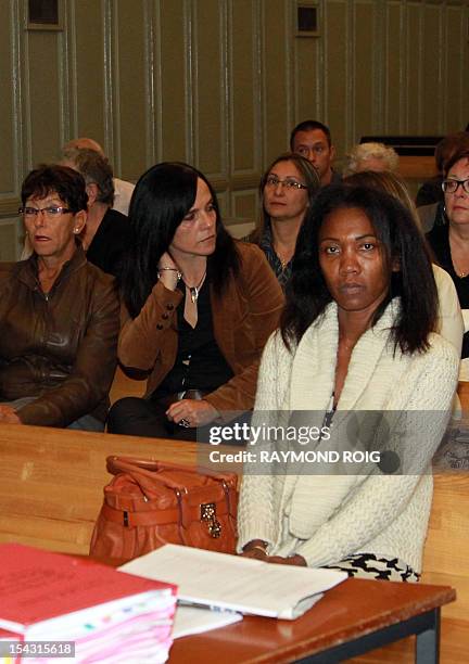 Diane Mistler , a Madagascan woman who allegedly tricked one of her many lovers into killing her husband with a fishing harpoon waits next to her...