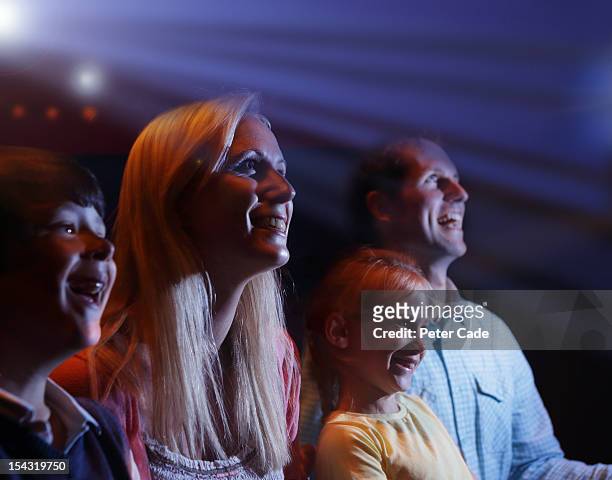 family of four happy in cinema - amor filme de 2012 imagens e fotografias de stock