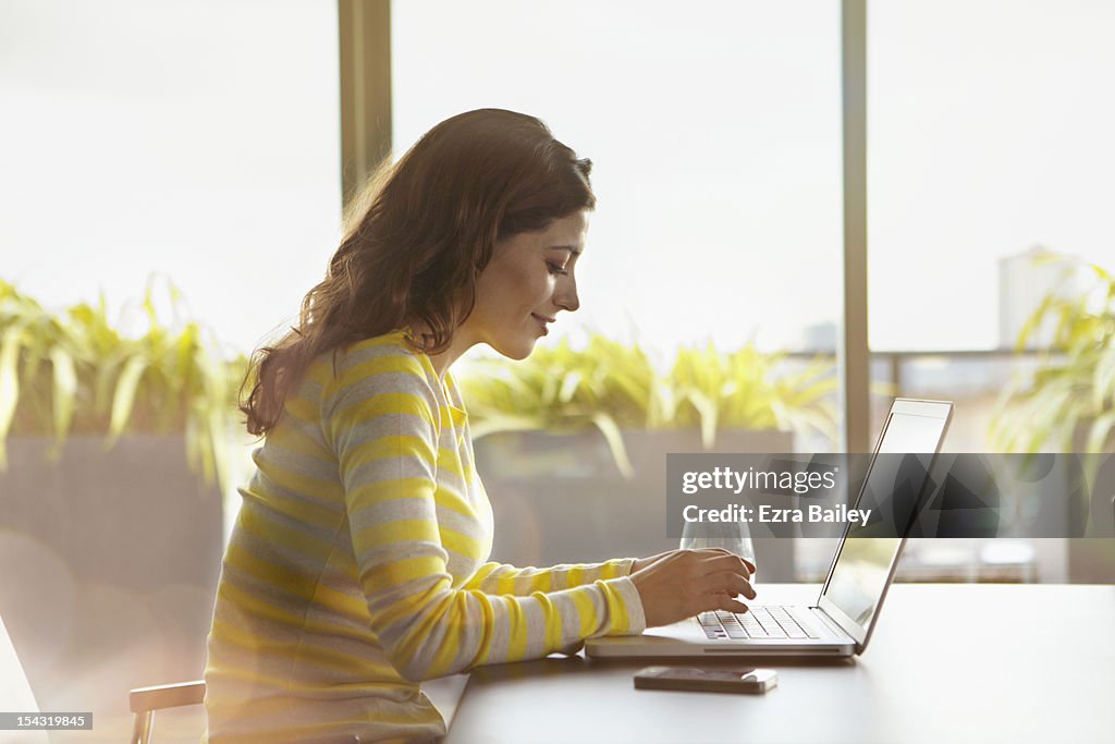 Woman working on her laptop.