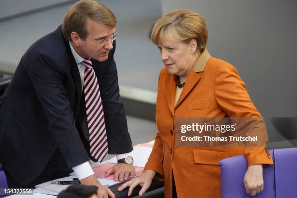 Chief of staff Ronald Pofalla and German Chancellor Angela Merkel talk at Reichstag, the seat of the German Parliament , on October 18, 2012 in...