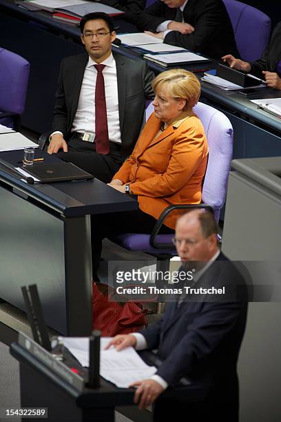 Peer Steinbrueck , Chancellor candidate of the German Social Democrats for the 2013 general election speaks whilst German Chancellor Angela Merkel...