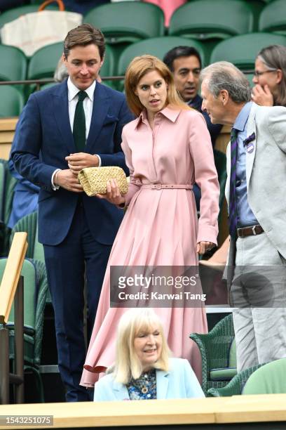 Edoardo Mozzi and Princess Beatrice return to their seats as they attend day twelve of the Wimbledon Tennis Championships at All England Lawn Tennis...
