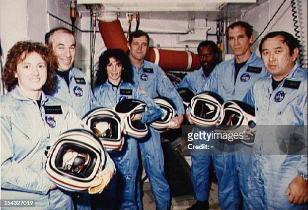The space shuttle Challenger mission STS 51-L crew pose for a portrait while training at Kennedy Space Center's Launch complex 39, Pad B in Florida...