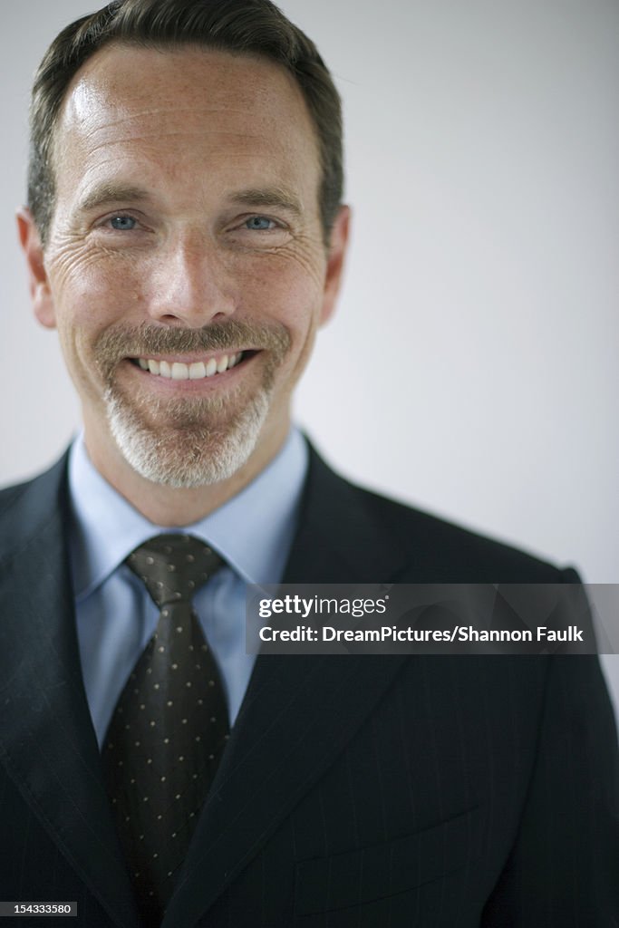 Portret of businessman smiling at camera