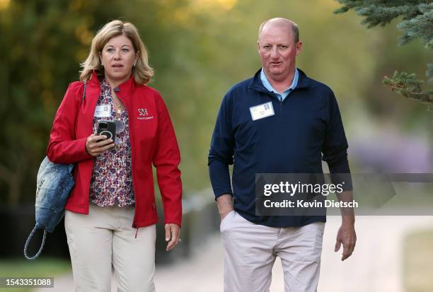 Greg Abel, CEO of Berkshire Hathaway Energy, and Andrea Abel walk to a morning session at the Allen & Company Sun Valley Conference on July 14, 2023...