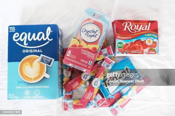 In this photo illustration, food products that contain the artificial sweetener aspartame including Equal, Crystal Light, Trident, and Royal Jello...