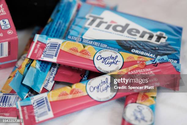 In this photo illustration, food products that contain the artificial sweetener aspartame including Crystal Light, and Trident gum are displayed on...