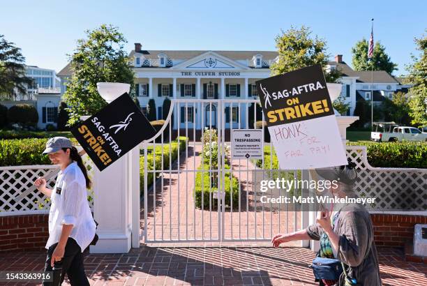 And WGA members walk the picket line on Day 2 outside Culver Studios, home of Amazon Studios, on July 14, 2023 in Los Angeles, California. Members of...