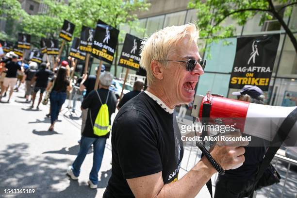Members of the Writers Guild of America East and SAG-AFTRA walk the picket line on Day 2 outside NBC Rockefeller Center on July 14, 2023 in New York...