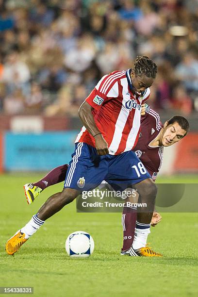 Shalrie Joseph of Chivas USA controls the ball against Martin Rivero of the Colorado Rapids during their MLS match at Dick's Sporting Goods Park...