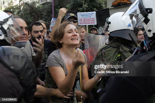 Protesters clash with riot police officers during a 24-hour nationwide general strike on October 18, 2012 in Athens, Greece. Hundreds of youths...