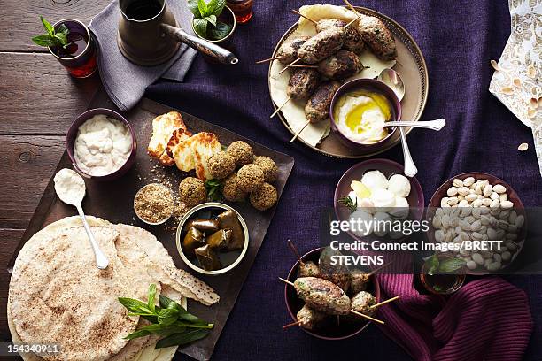 plates of breads, meats and cheeses - grilled halloumi stock pictures, royalty-free photos & images