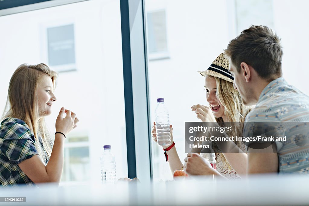 Students eating together in cafeteria