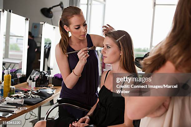 model having her makeup done - behind the scenes stock pictures, royalty-free photos & images