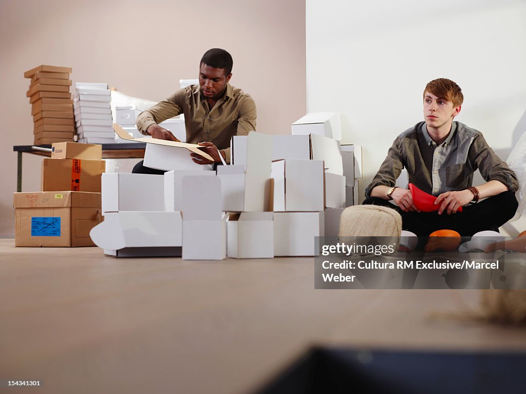 Businessmen working in messy office