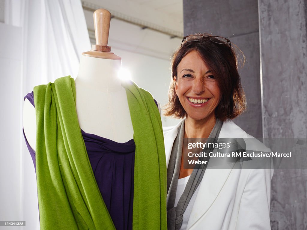 Clothing designer smiling in studio