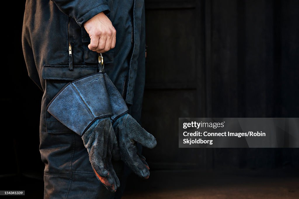 Fire fighter holding gloves