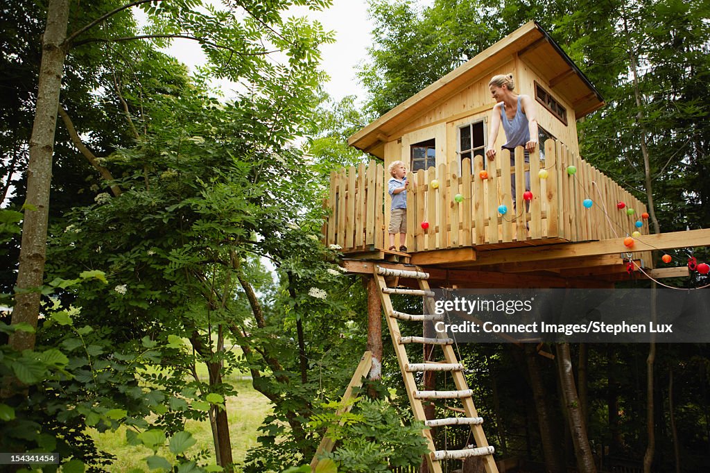 Mother and son talking in treehouse