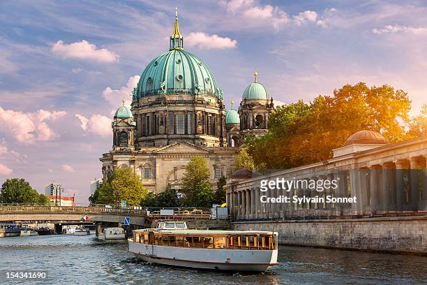 berlin, a tour boat on the spree river - berlin stockfoto's en -beelden
