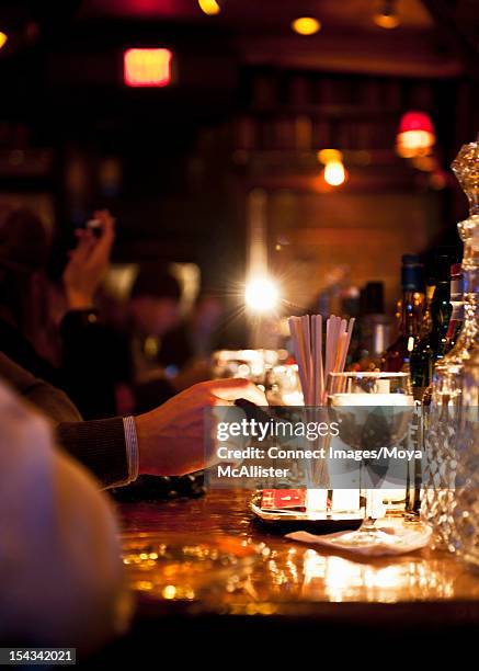 businessman tapping cigar at bar - candlelight stock pictures, royalty-free photos & images