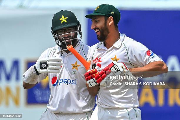 Pakistan's Imam-ul-Haq and Agha Salman walk back to the pavilion after Pakistan won by 4 wickets on the fifth and final day of play of the first...