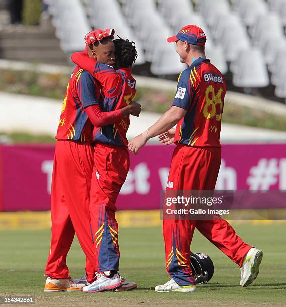 Highveld Lions players celebrate during the Karbonn Smart CLT20 match between bizbub Highveld Lions and Sydney Sixers at Sahara Park Newlands on...