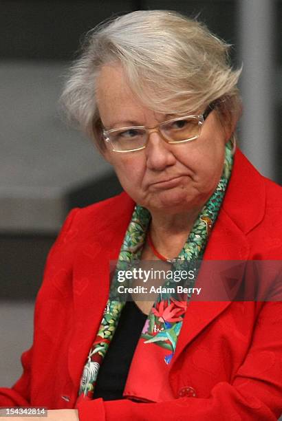 German Federal Education Minister Annette Schavan listens to a government declaration by German Chancellor Angela Merkel in the Bundestag prior to a...