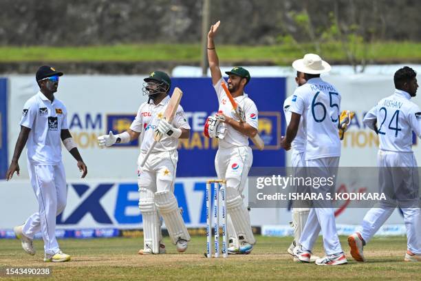 Pakistan's Imam-ul-Haq and Agha Salman celebrate after Pakistan won by 4 wickets on the fifth and final day play of the first cricket Test match...